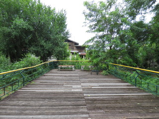 The old wooden bridge and benches in the park.
