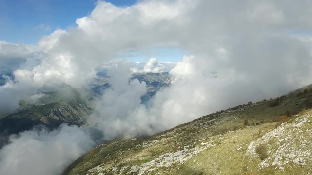 View from the top of the mountains and clouds. Footage. could be seen far away high mountains