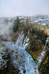 Shirogane hot spring village of Biei City, stands this 30m tall waterfall. The water flowing down the gaps between the rocks resembles a white beard, earning it the name Shirohige (white beard).
