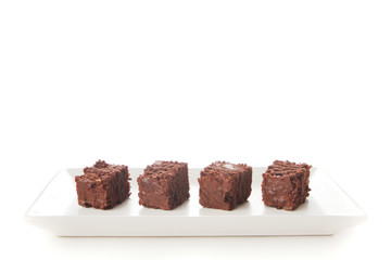 Homemade chocolate brownies served on a plate