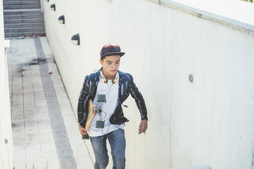 Young student man with longboard