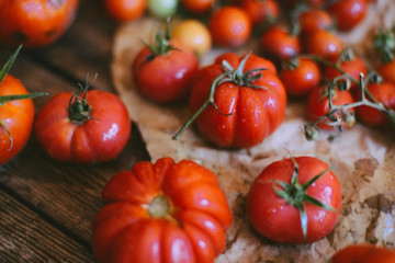 Fresh cherry tomatoes on rustic wooden table, Top view with copy space.