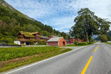 Traditional red fishing rorbu hut near Alesund in Norway