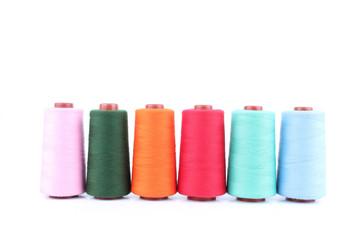 Colorful Sewing threads isolated on white background