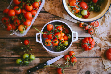 Fresh cherry tomatoes on rustic wooden table, Top view with copy space.