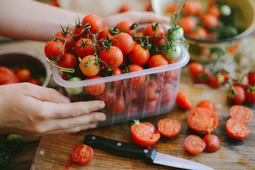 Fresh cherry tomatoes on rustic wooden table, Top view with copy space.