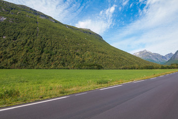 Panorama of summer landscape in Norway - river, stones, mountings
