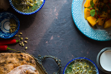 Indian food still life on the dark background top view