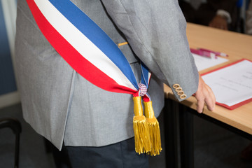 French mayor with a scarf flag during ceremony weeding day