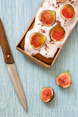 Delicious fig cake on blue background
