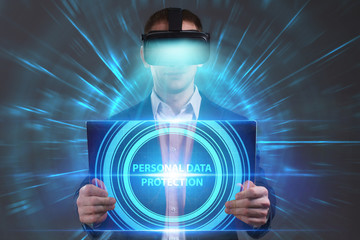 Business, Technology, Internet and network concept. Young businessman working in virtual reality glasses sees the inscription: Personal data protection