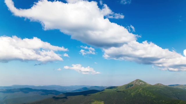 4K. Mountains with clouds and blue sky.Without birds, time lapse