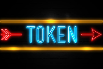 Token  - fluorescent Neon Sign on brickwall Front view