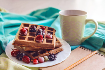 Homemade Waffles with Berry. Relax desk table concept notebook hot cup coffee