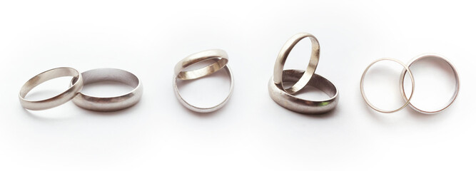 White gold ring concept. Classic wedding rings on white background