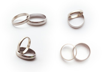 White gold ring concept. Classic wedding rings on white background