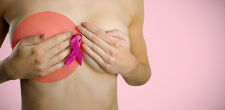 Composite image of naked woman with pink ribbon covering breast 