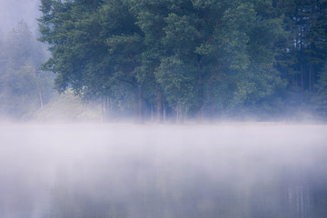 Fototapeta premium Lake at foggy morning misty weather