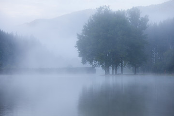 Fototapeta premium Lake at foggy morning misty weather