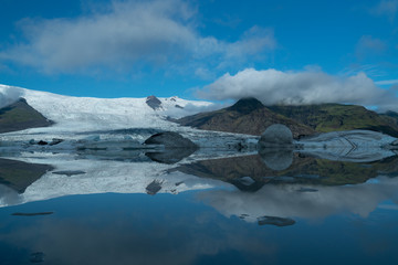 Fototapeta na wymiar Perfect early morning reflection of glacier in Iceland