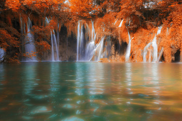 Beautiful fall colors forest waterfall and lake