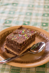 Chocolate cake with colorful sprinkles on the plate