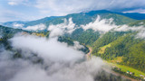 village at mountains in the morning mist. aerial photography