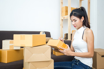 Young Asian Woman Working at home, Young Owner Woman Strat up for Business Online, SME, Delivery Project, Woman with Online Business or SME Concept.