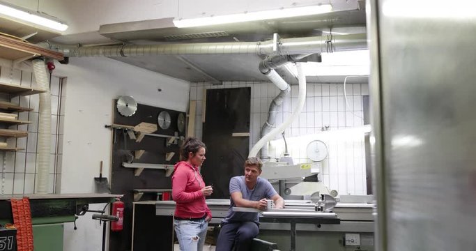 Team having a coffee break in craft workshop
