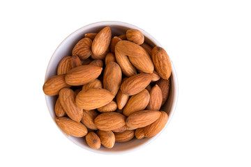 White ceramic bowl with almond isolated on white background