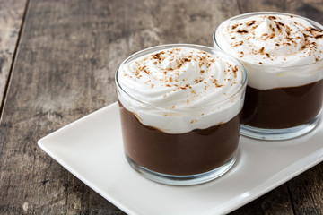 Chocolate mousse on wooden table. Copyspace.
