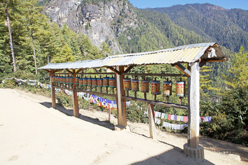 Fototapeta na wymiar Prayer wheels along the footpath to the Tiger's Nest, Paro, Bhutan