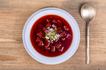 Close up of russian or ukrainian cold vegetable beetroot soup on the table