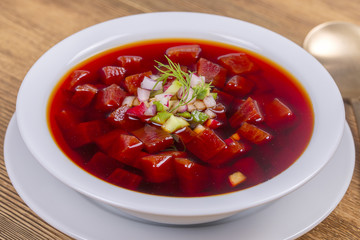 Close up of russian or ukrainian cold vegetable beetroot soup on the table