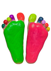 Baby feet in bright rainbow colors. Isolated on a white background.