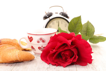 coffee cup and red rose