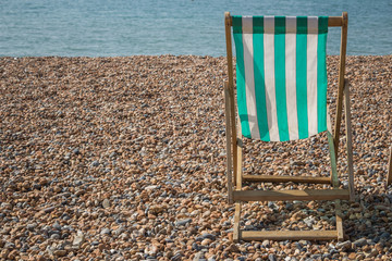 Lone Lounge Chair on the Beach.  No people and copy space