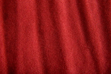 Extremely close-up. Red fabric, texture.