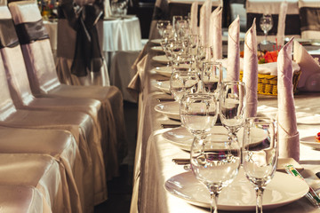 Preparation for the banquet. Rows of wine glasses.