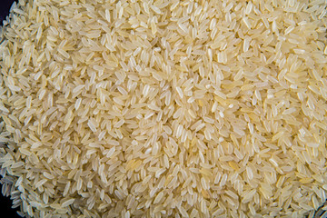 A bunch of rice on a plate close up. Rice as an ingredient for soup making. Macro shooting.