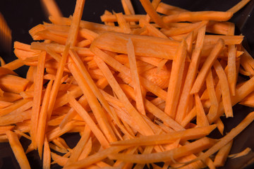 Finely chopped carrots as an ingredient for soup making.