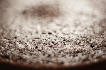Macro shot of a chocolate cake showing crumb texture. No frosting. Shallow depth of field.