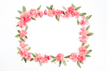Fototapeta na wymiar Floral frame with space for text made of pink hydrangea flowers, green leaves, branches on white background. Flat lay, top view. Floral background. Frame of flowers.