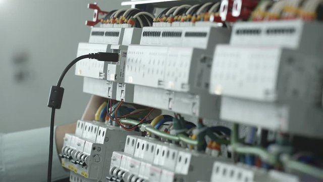 Employee includes a cable in electrical Cabinet