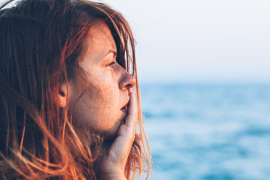 Young Woman Feeling Sad By The Sea