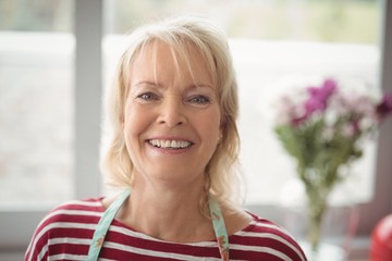 Smiling senior woman looking at camera