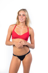 Obraz premium stupendous girl young blonde, in bikini on white background ,perfect body 