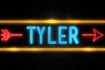 Naklejka na ściany i meble Tyler - fluorescent Neon Sign on brickwall Front view