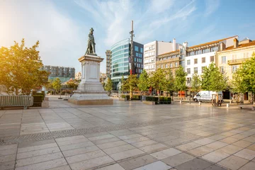 Fototapeten View on the Jaude square during the morning light in Clermont-Ferrand city in central France © rh2010