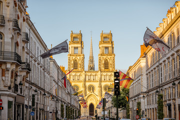 Fototapeta premium Street view with famous cathedral during the sunset in Orleans city in central France